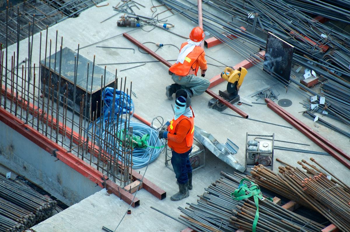 Construction site with cranes at sunset